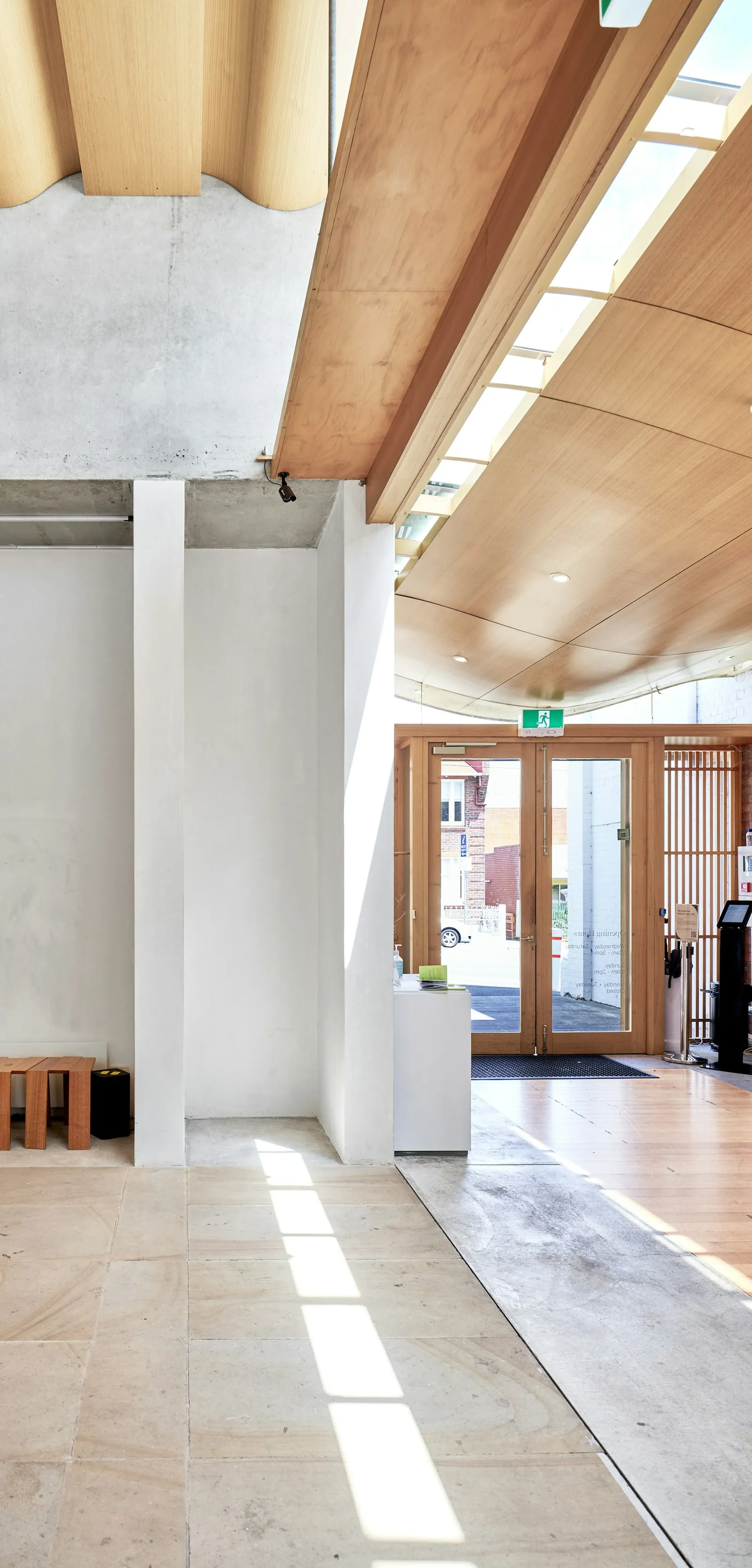 A bright hall with timber beams and rooflights