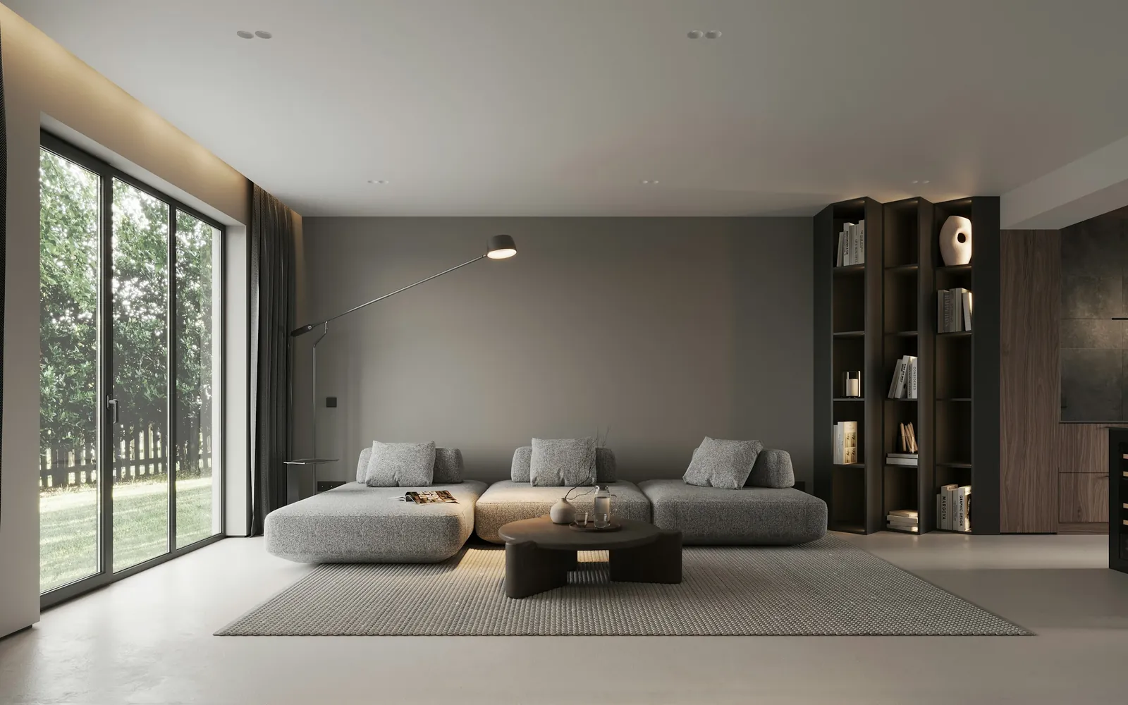 A calm living room with a glazed wall onto trees