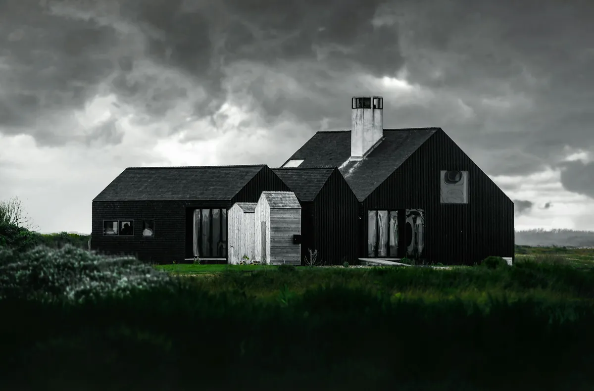 Hartington House: a cluster of black timber roofs in open moorland