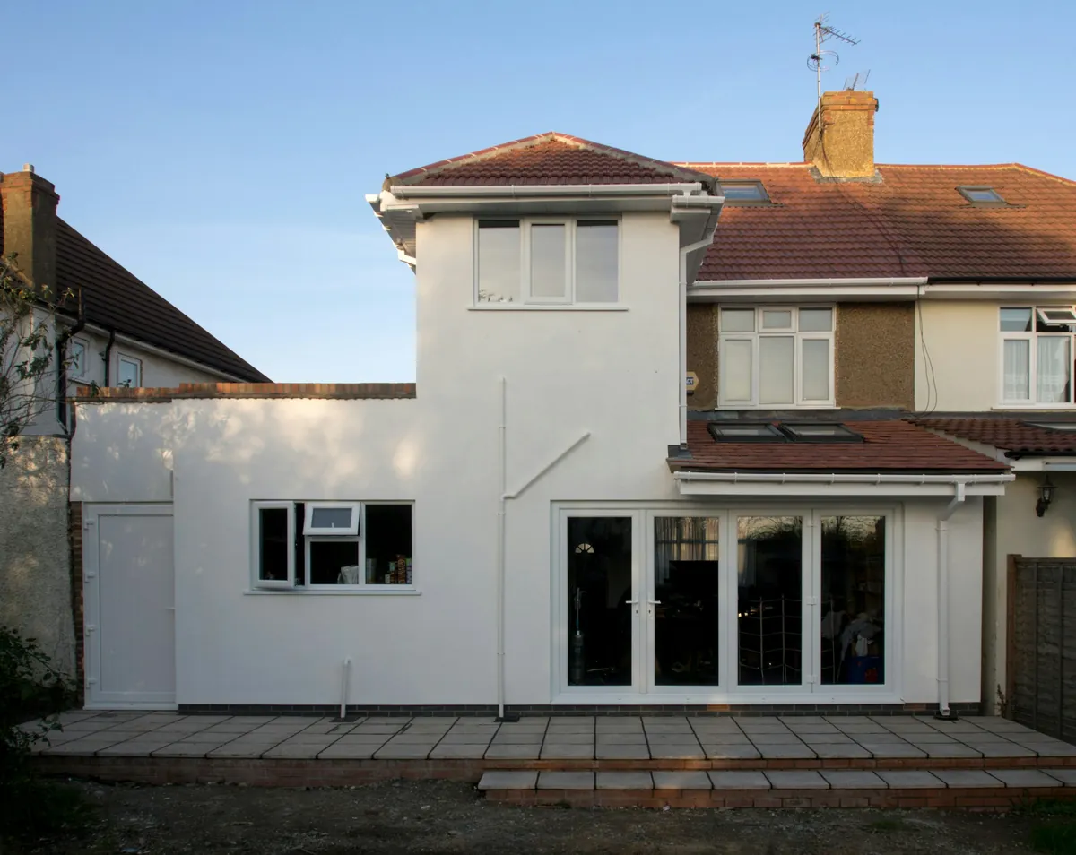 Lenton Villa: a rendered single-storey extension on the back of a 1930s semi