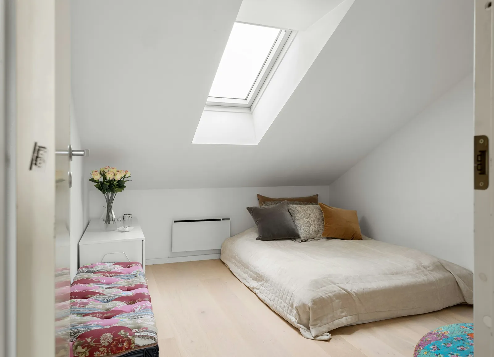 An attic bedroom with a conservation rooflight