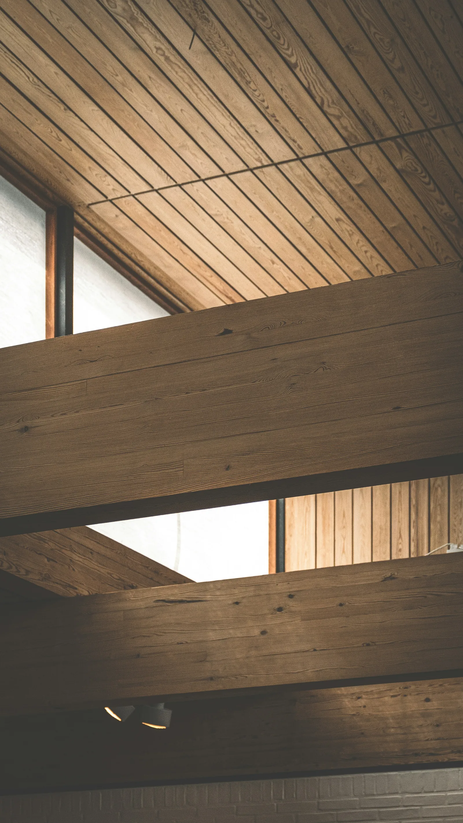 Timber-lined ceiling with a square rooflight cut into it