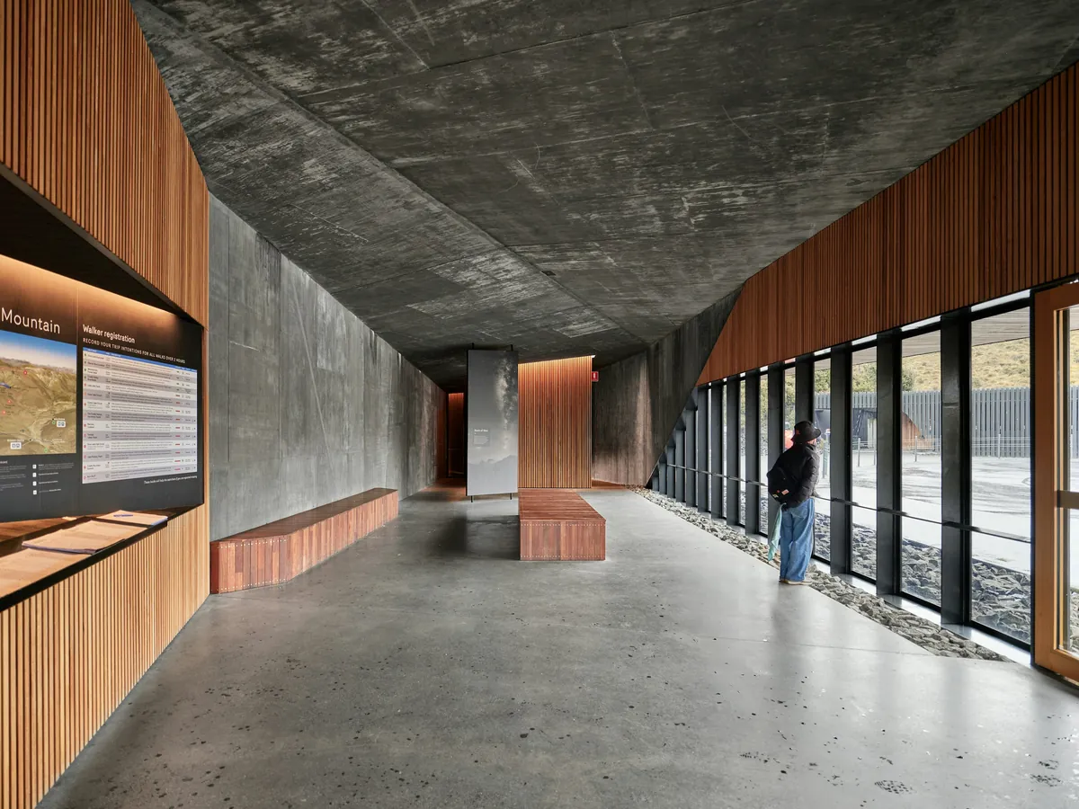 Quarry Studios: a concrete hall with timber-lined walls and a glazed side