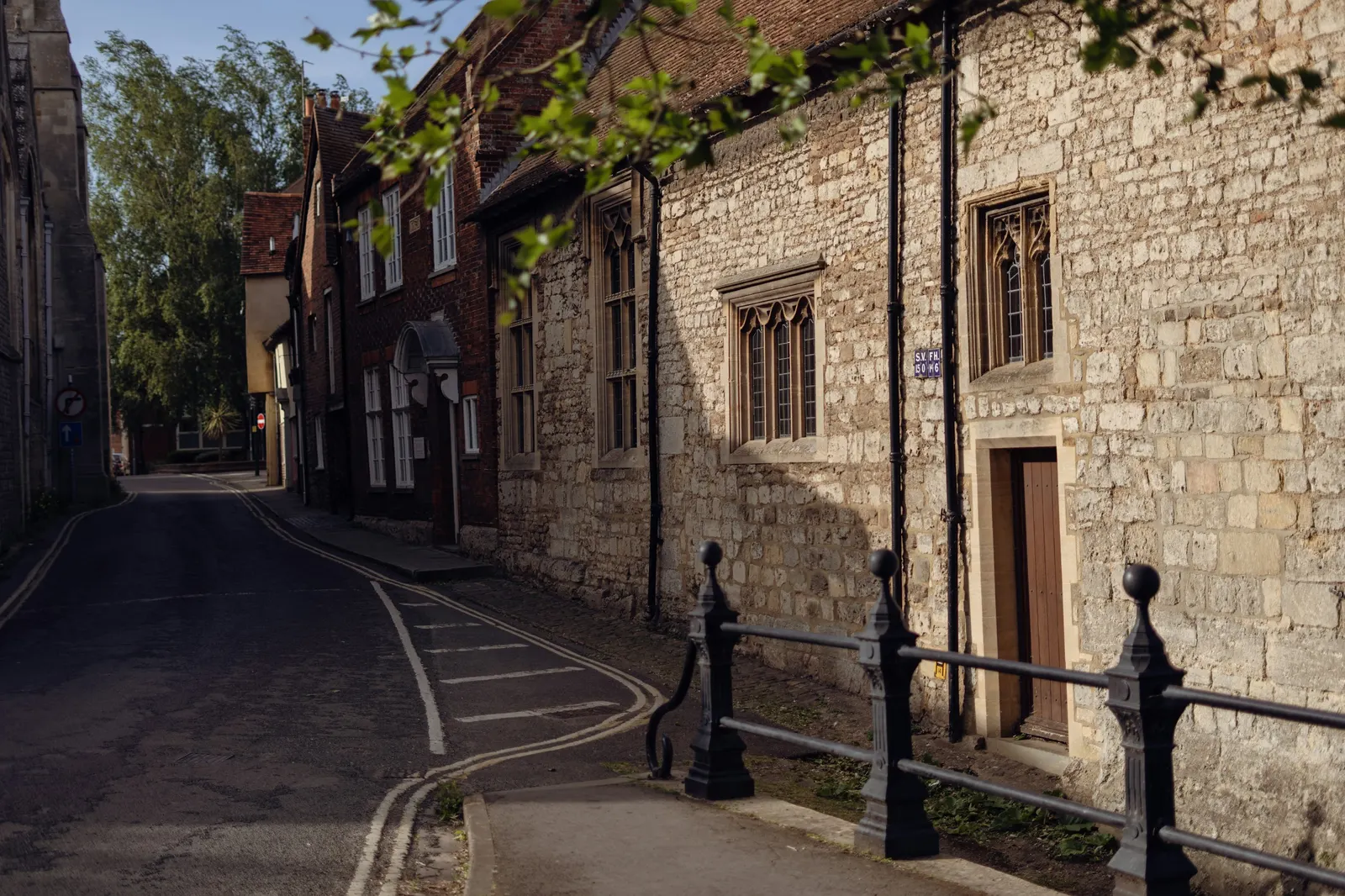 A narrow stone-walled lane in a village
