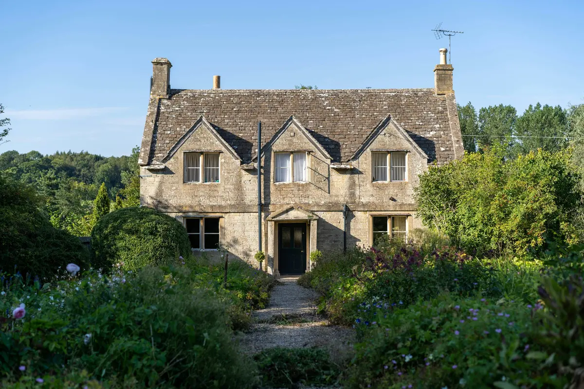 Brook Cottage, a stone cottage set in a cottage garden