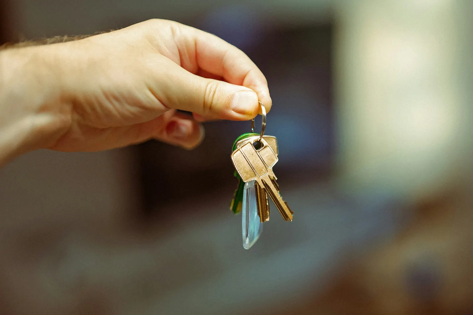 A bunch of keys held out in an open hand