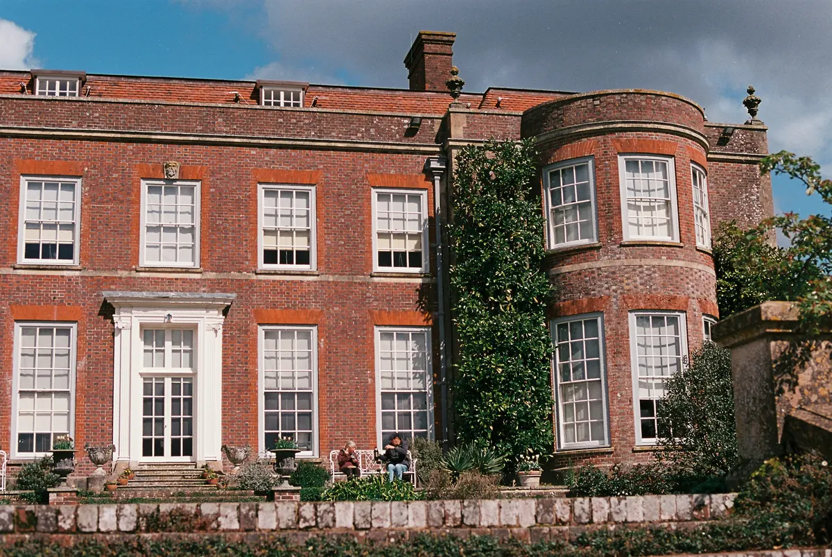 Mill House, a red-brick Georgian house with a bay and a walled garden