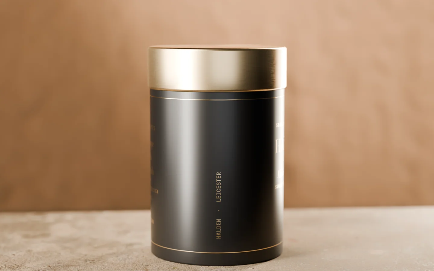 The side of the tin, with HALDEN · LEICESTER printed down it in gold