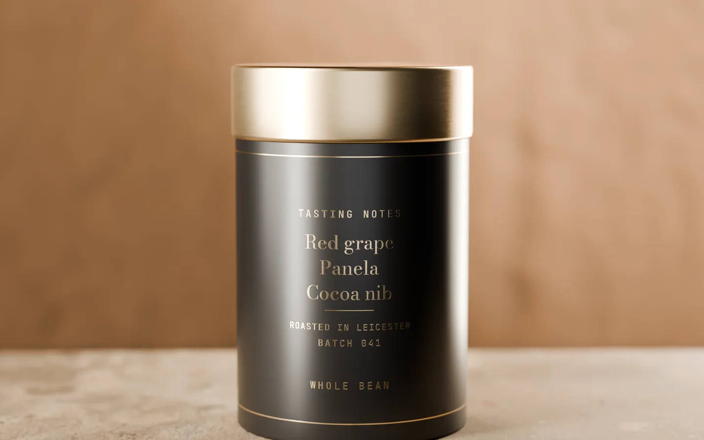 The back of the tin: tasting notes red grape, panela and cocoa nib, roasted in Leicester, batch 041, whole bean