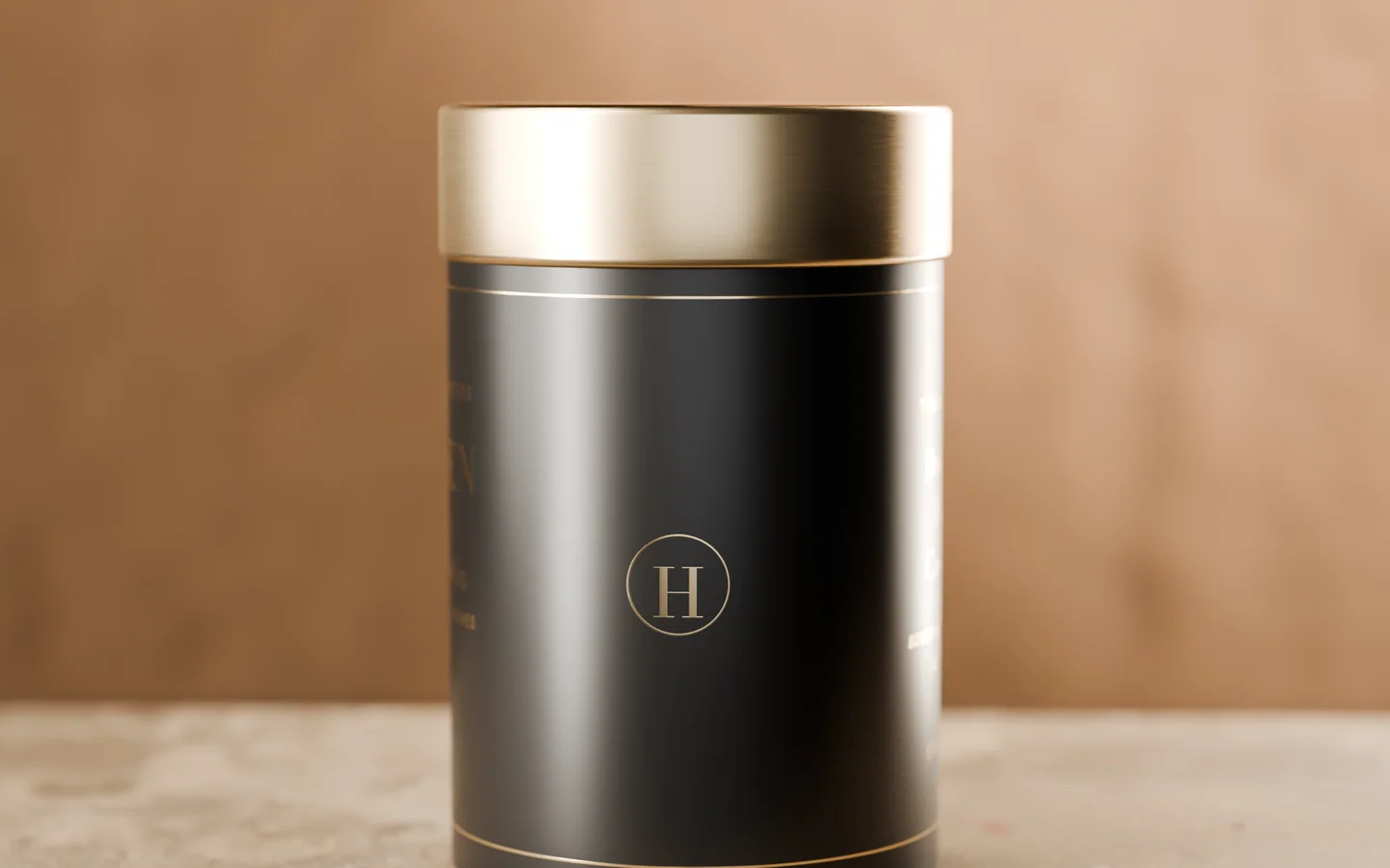 The fourth side of the tin: a capital H inside a fine gold ring