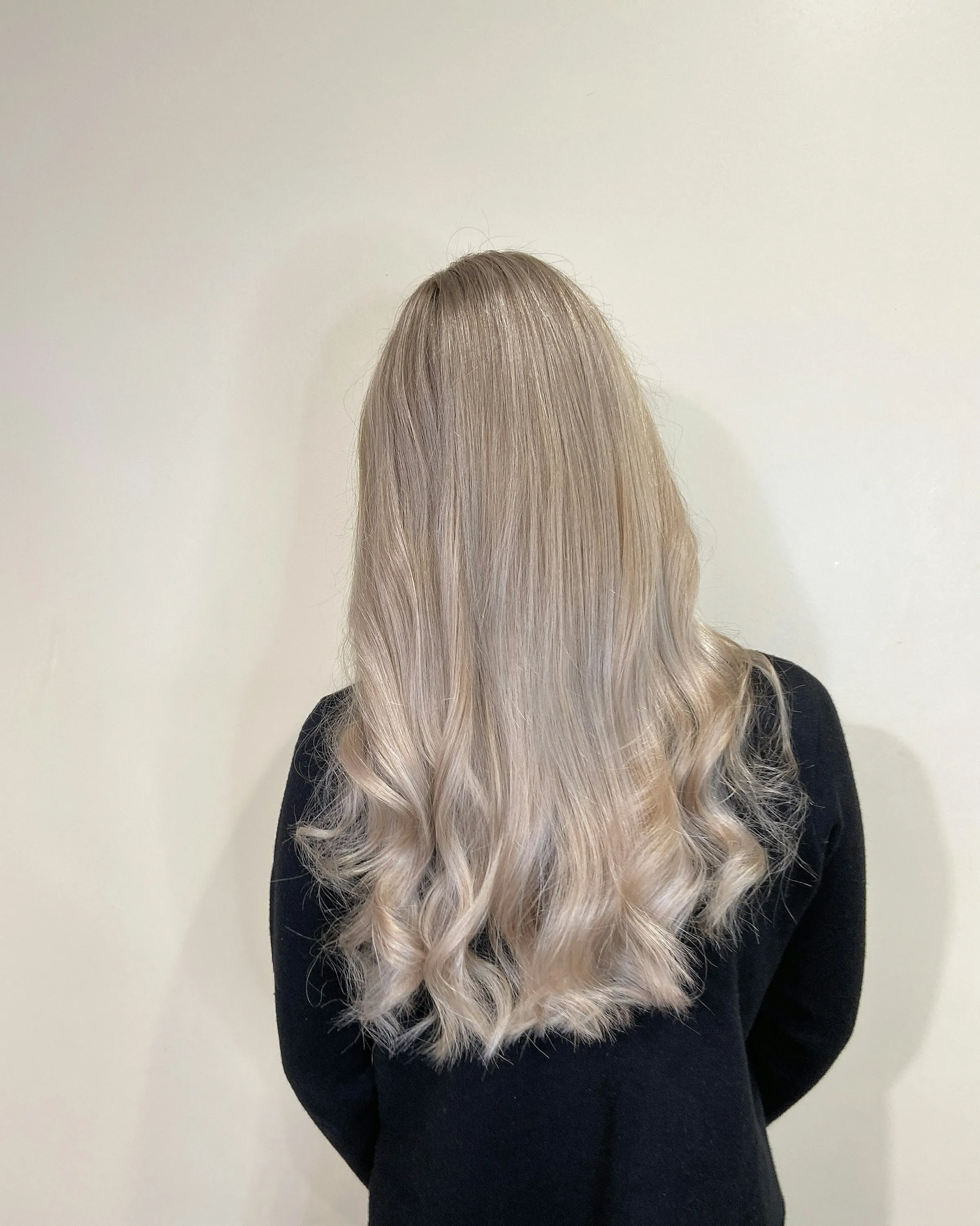 The same hair toned cool and waved, from behind