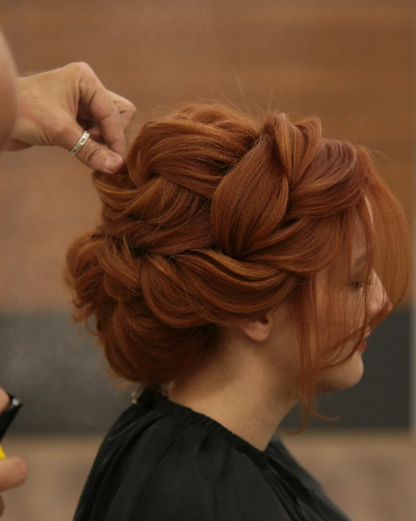 Pins going into a copper up-do from the side
