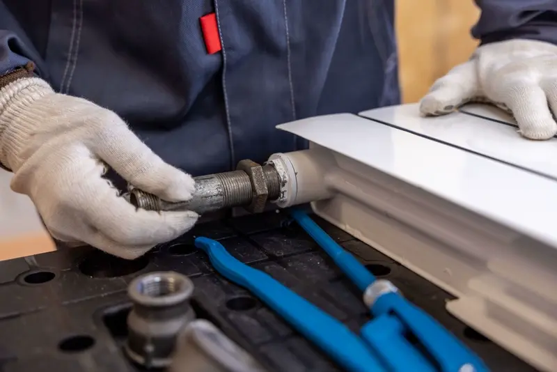 Fitting a new valve to a white radiator