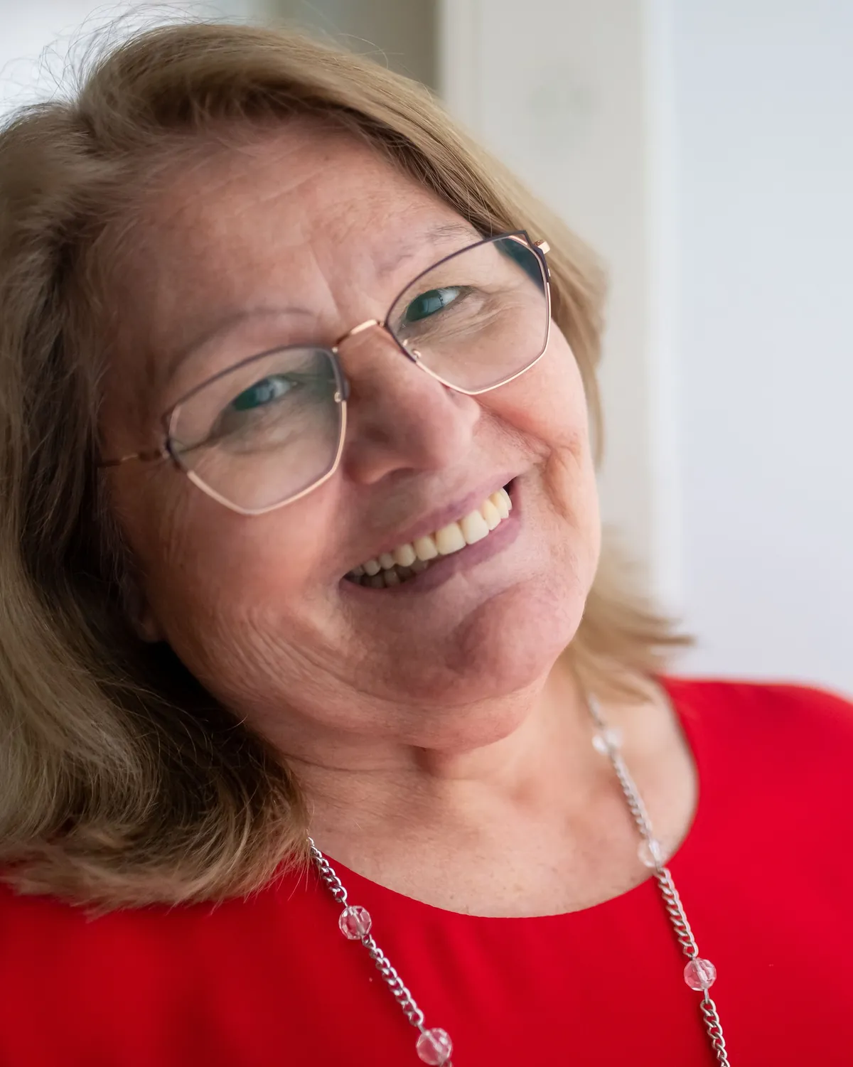 Donna Whitmore, the registered manager, smiling in the front office.